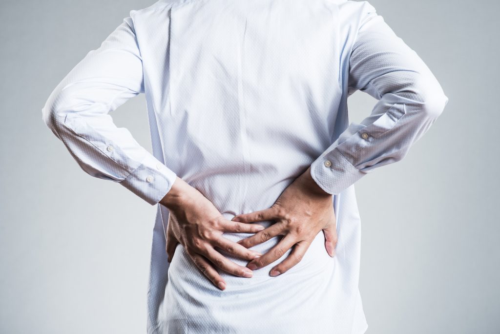 Back At It What You Need To Know About Causes And Treatments For Back Pain   Canva Male Low Back Pain 1024x684 